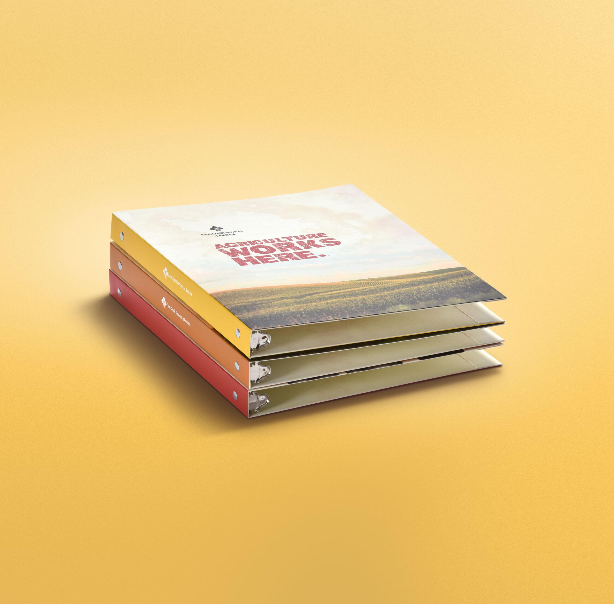 Presentation binder stack fro Farm Credit Services