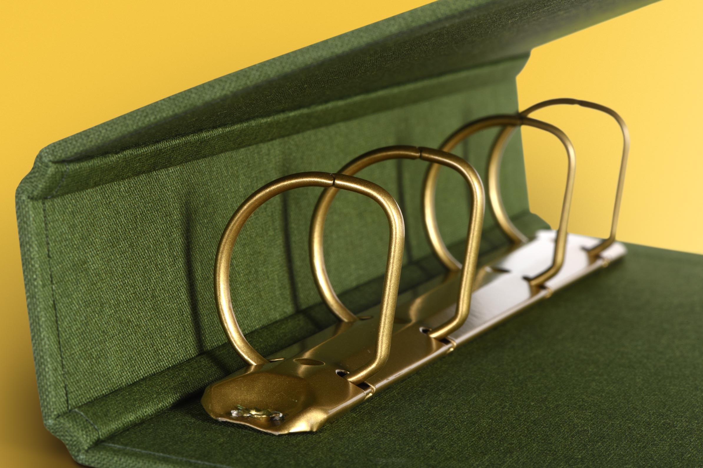 Closeup of powder coated rings inside cloth binder