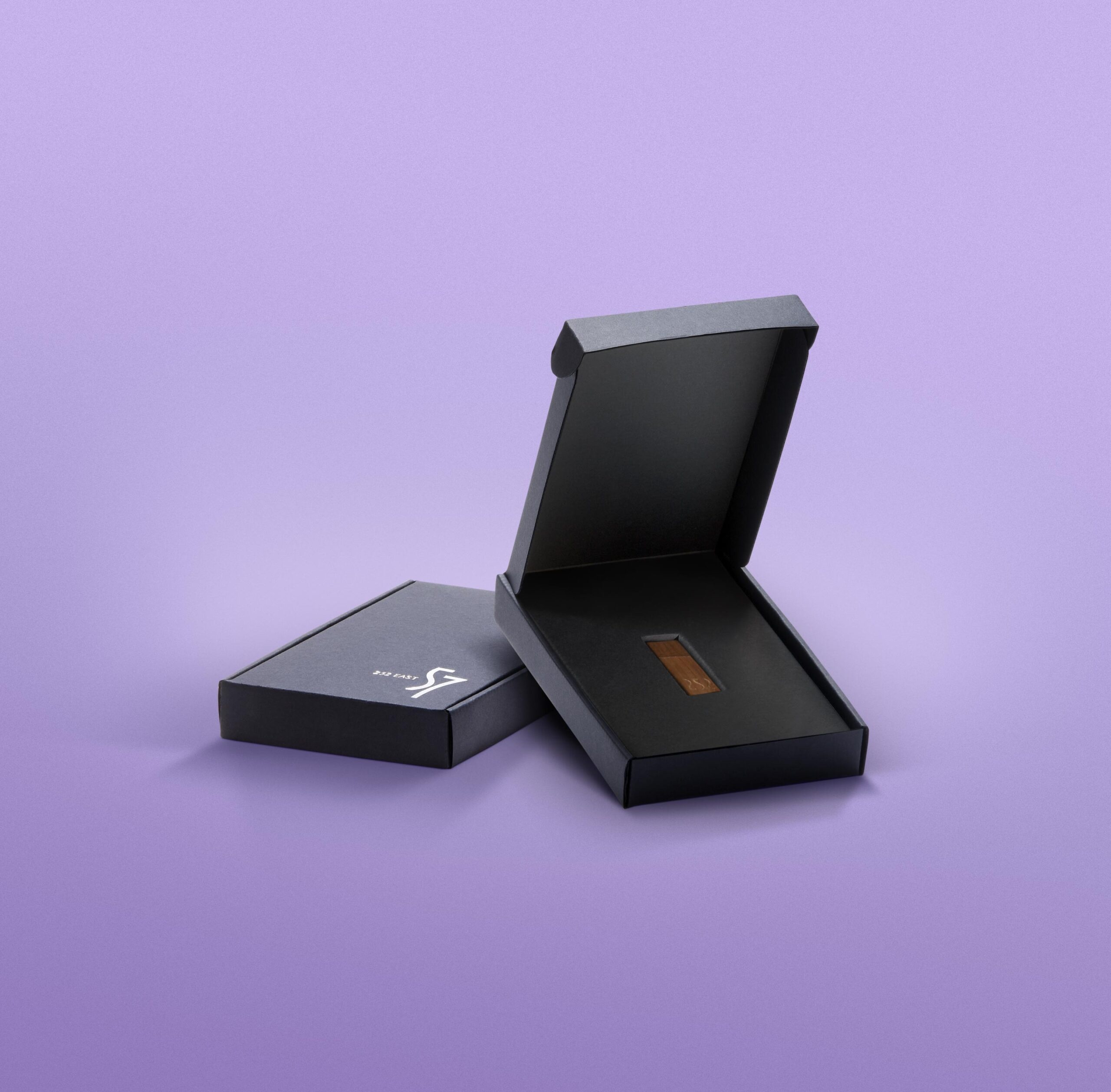 Set of black corrugated boxes with silver foil stamping