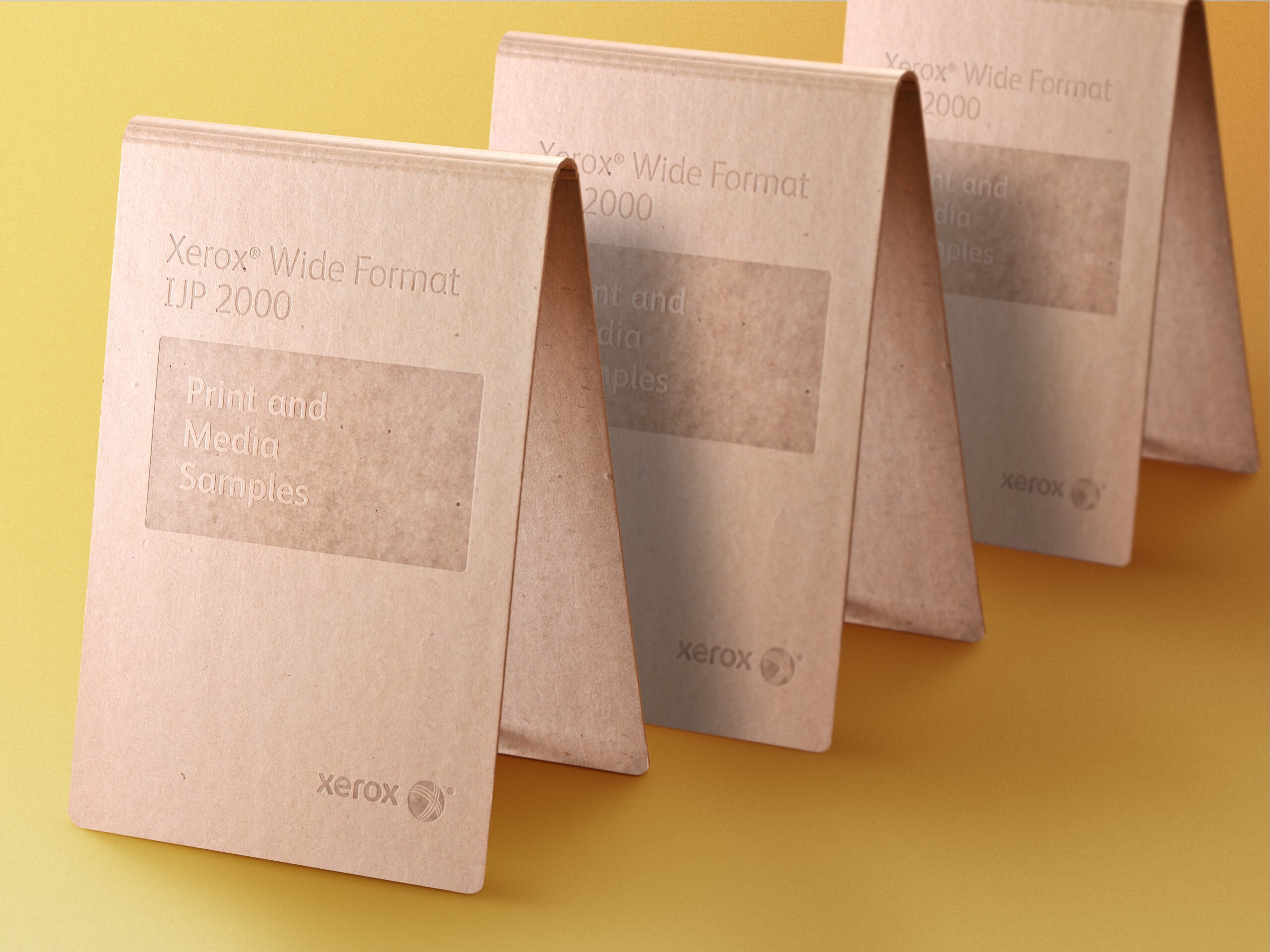 Naked binder with blind debossing for Xerox