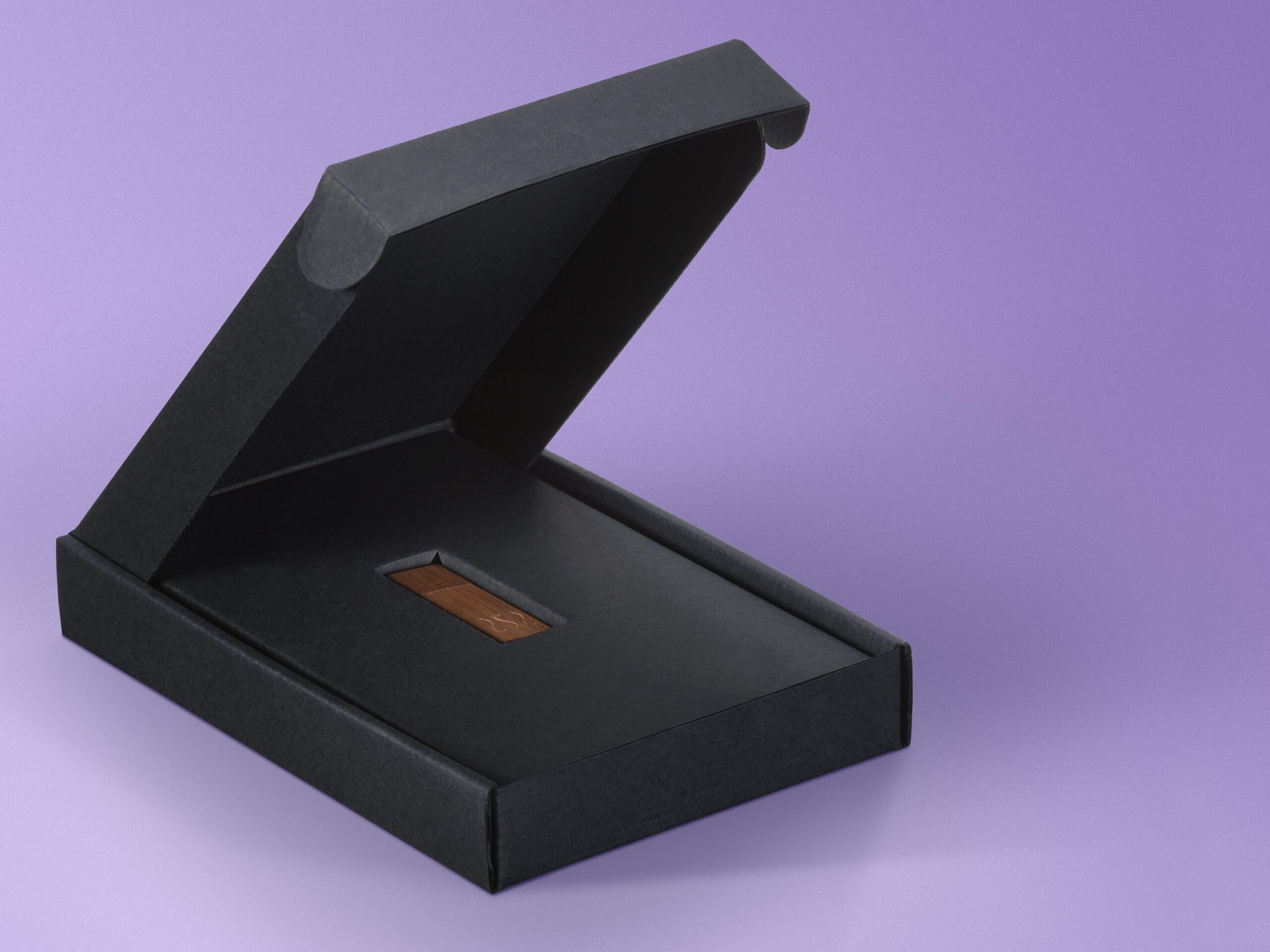 Triple Black corrugated box showing custom insert to hold USB flash drive