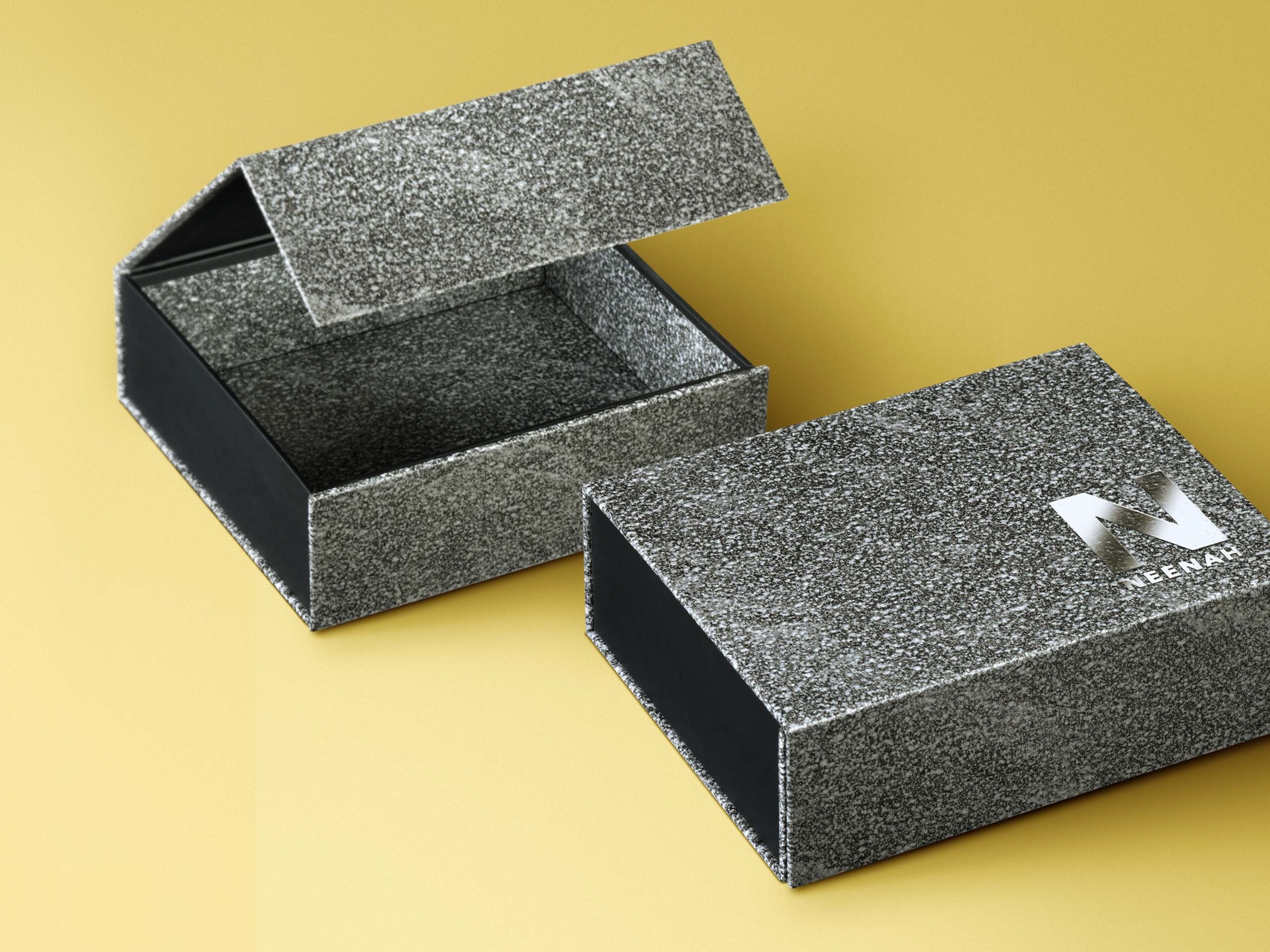 Magnetic CI RIGIDBOX® packaging for Neenah showing CORVON rock cover material