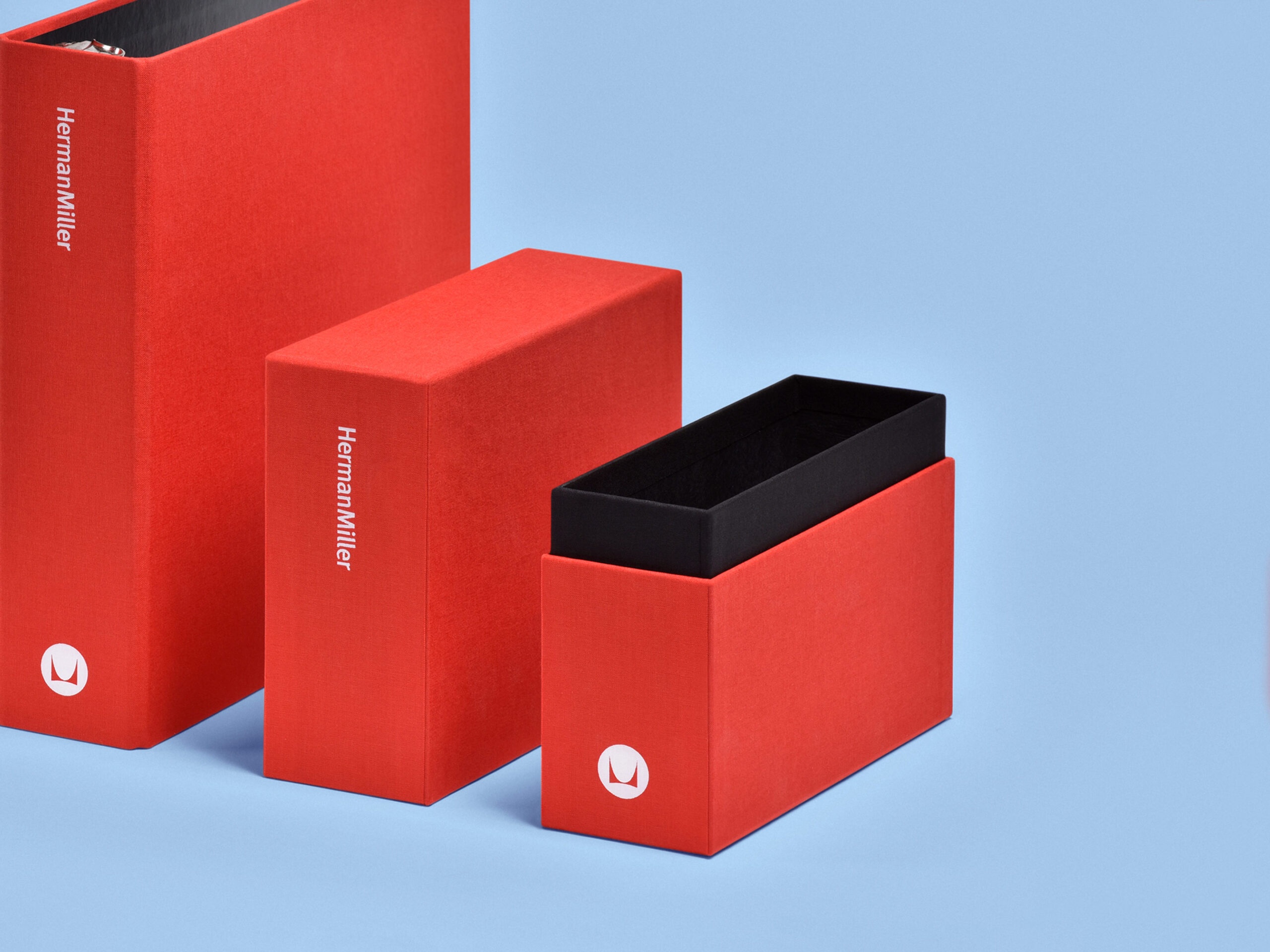 Herman Miller binder and neck&shoulder box cased in red cloth