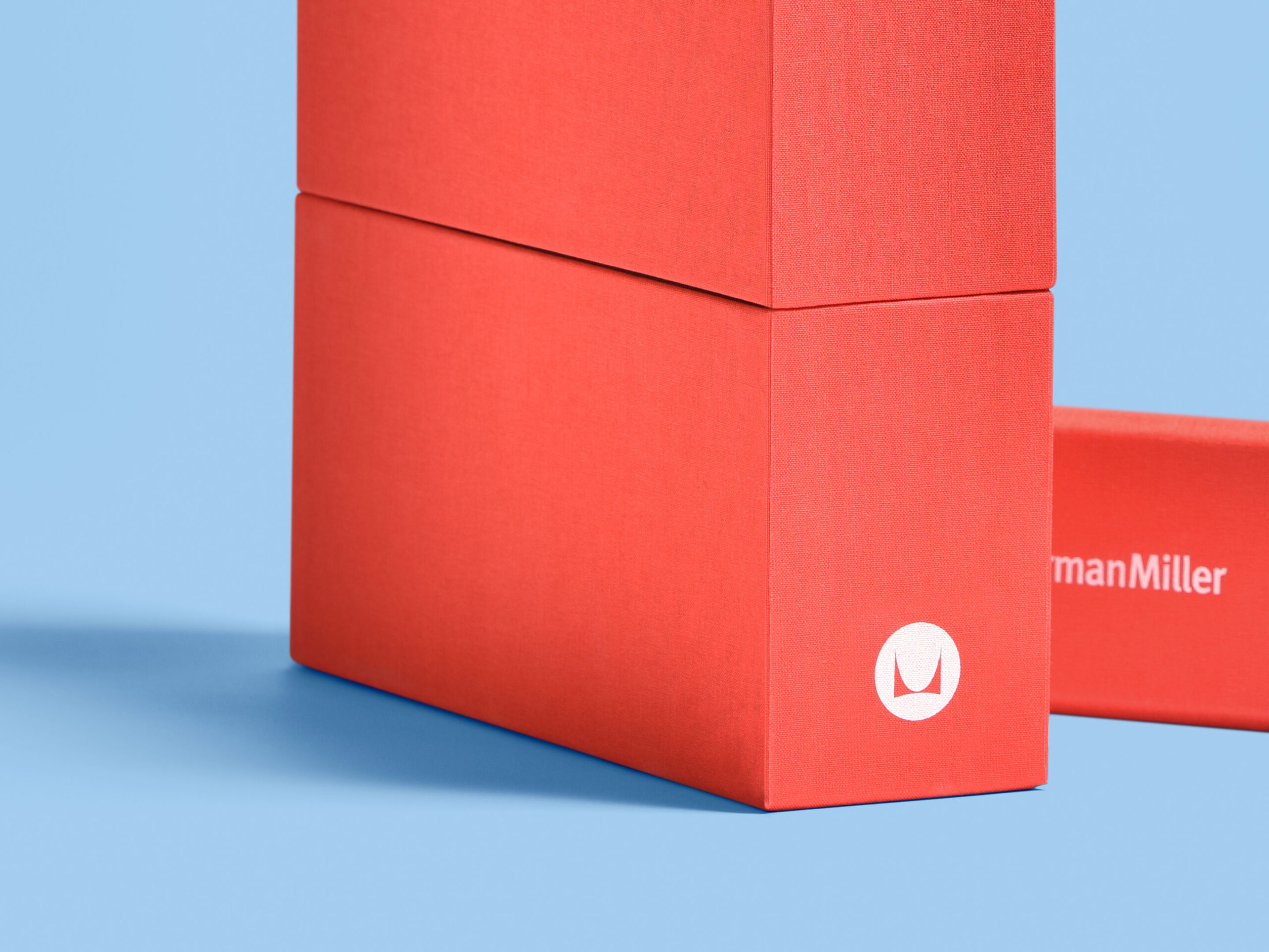 Herman Miller turned-edge luxury packaging with red cloth